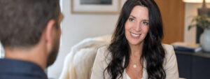 Annette Benedetti speaking with a male client during a private sex and relationship coaching session