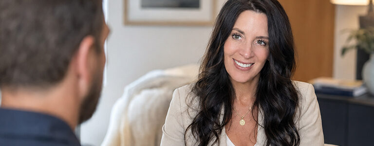Annette Benedetti speaking with a male client during a private sex and relationship coaching session