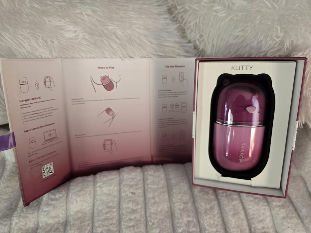 the Klitty trillple action vibrating toy in the box with instructions