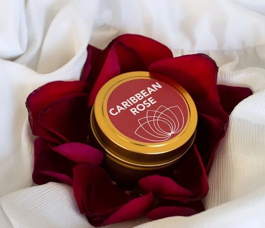 Good Clean Love Caribbean Rose Massage candle on a roase and white background for how to have a nipple orgasm