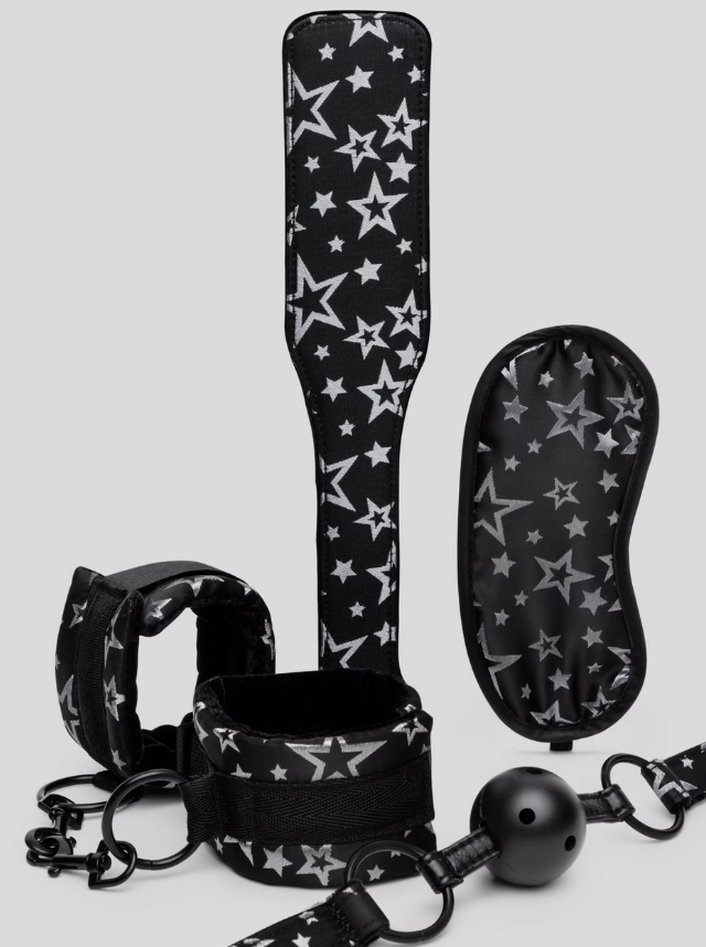 Bondage Boutique Stars 4-piece beginner bondage kit with handcuffs, ball gag, blindfold, and paddle